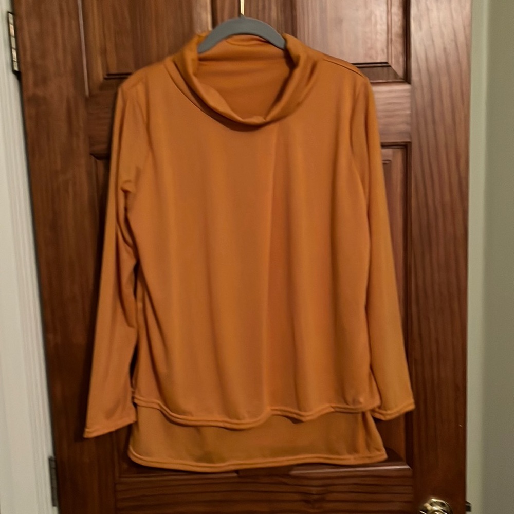 Woman’s long sleeve top.